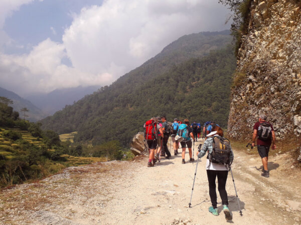 trekkers - on the way to mountain trekking in Nepal