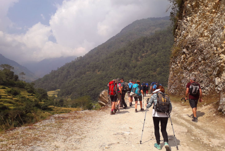 trekkers - on the way to mountain trekking in Nepal